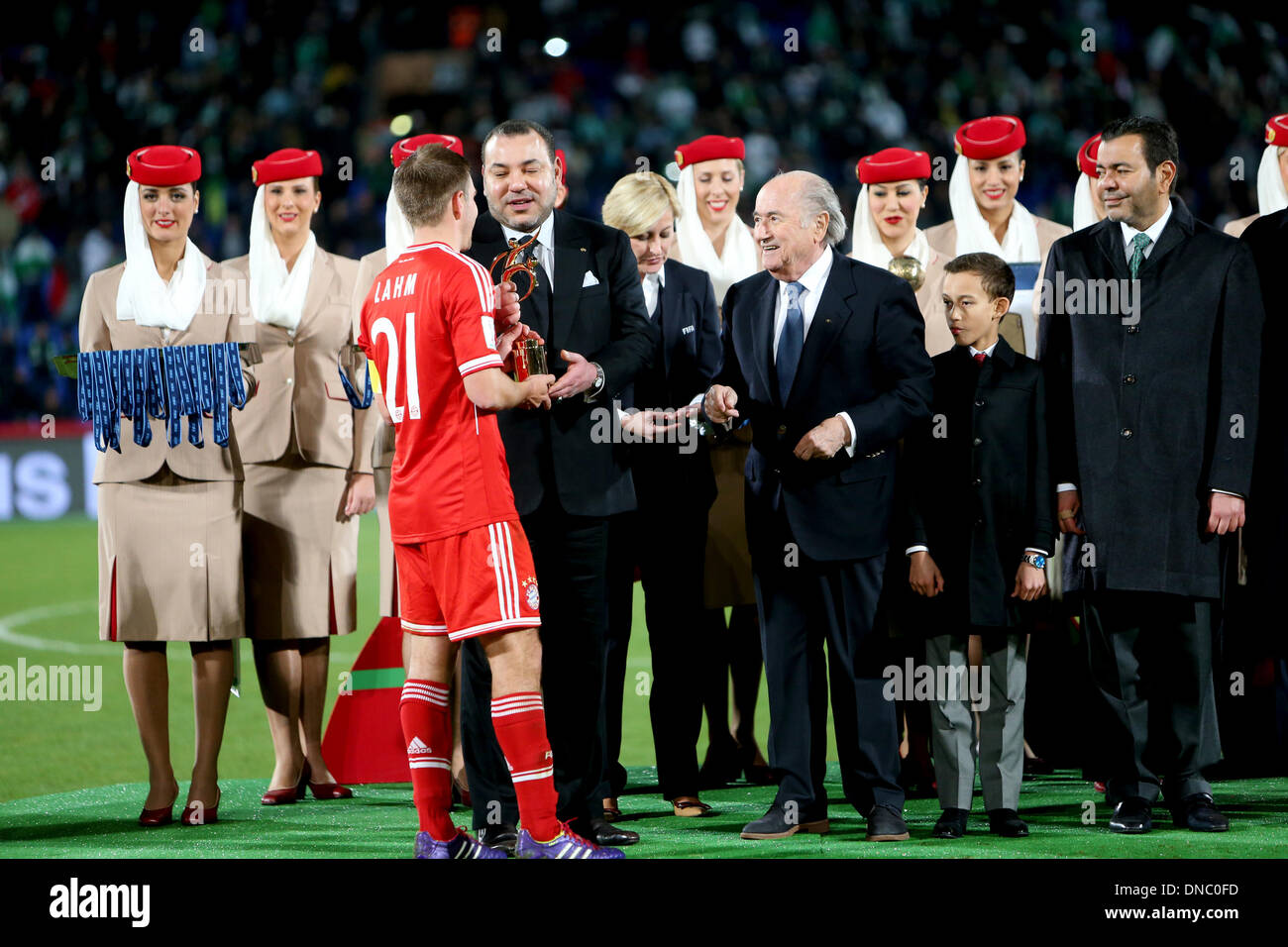 Marrakech , Morocco. 21st Dec, 2013. HRH MOHAMMED IV presents the trophy to Philipp LAHM after the FIFA Club World Cup Final game between Bayern Munich and Raja Casablanca from the Marrakech Stadium. Credit:  Action Plus Sports/Alamy Live News Stock Photo