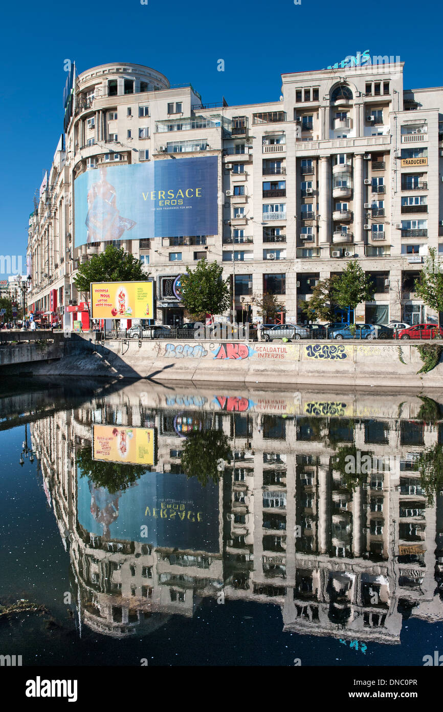 Buildings reflected in the Dâmbovița River in Bucharest, the capital of Romania. Stock Photo