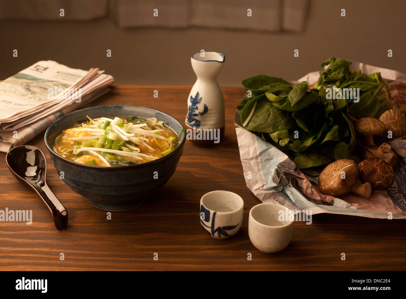 Ramen soup still life with sake and vegetables Stock Photo