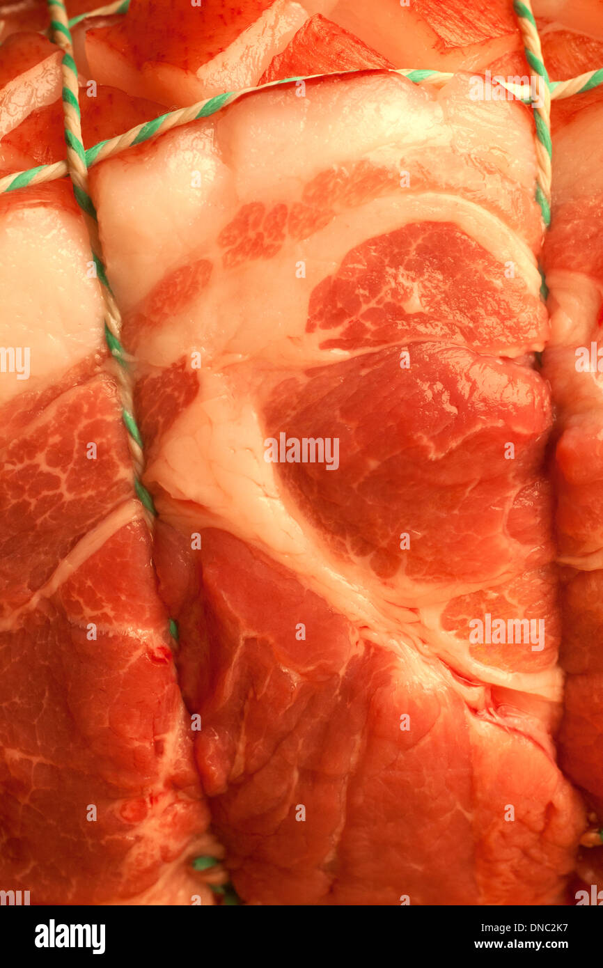 Close up / detail raw tied pork roast Stock Photo