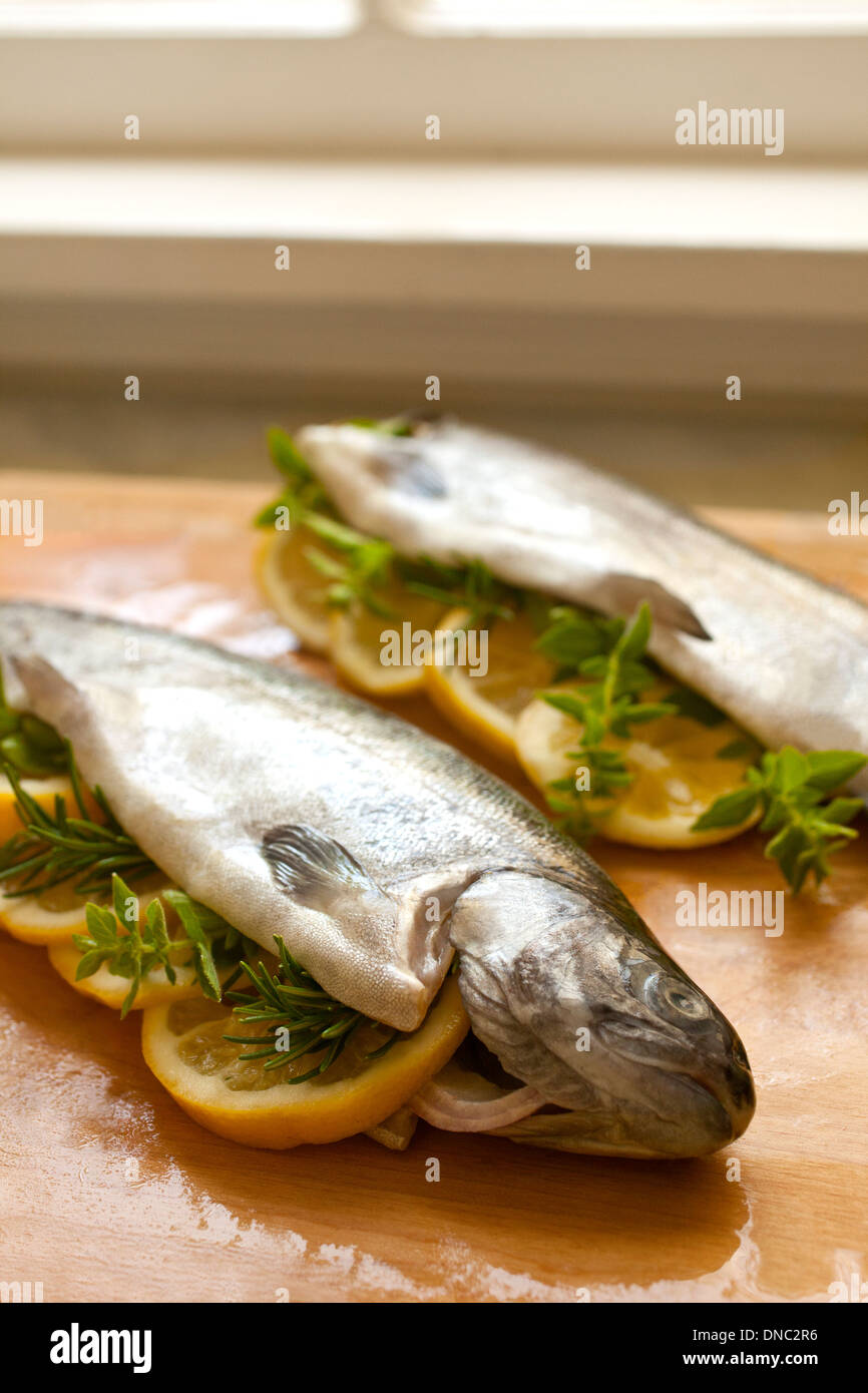 trout stuffed with lemon slices and thyme Stock Photo