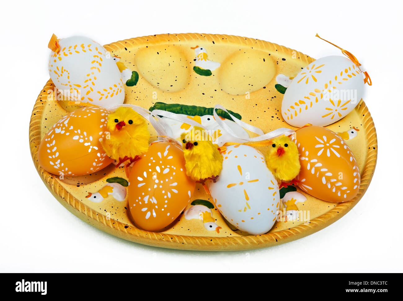 yellow chickens and colorful eggs ready for easter Stock Photo