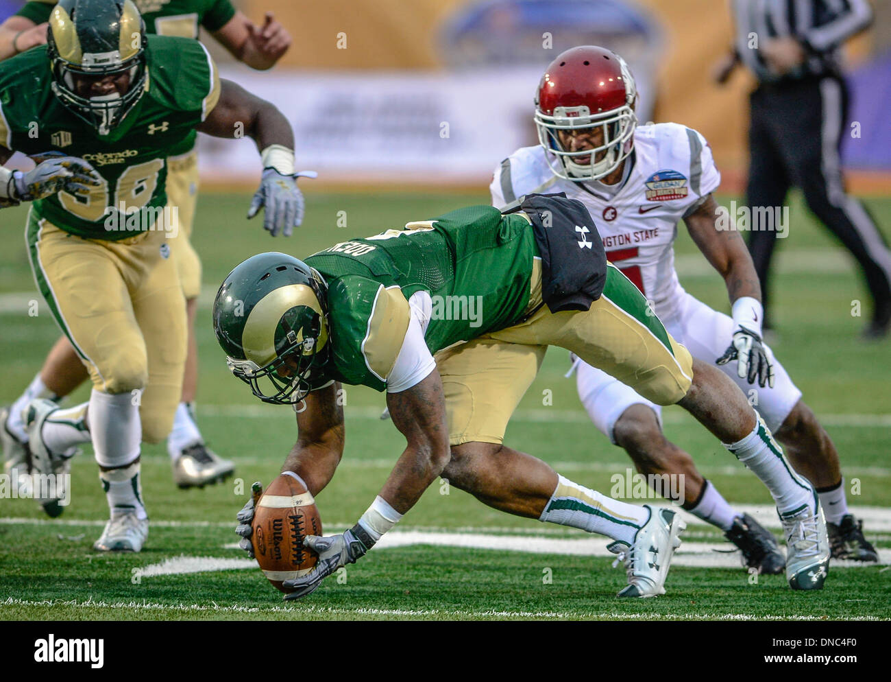 Albuquerque, New Mexico, USA. 21st Dec, 2013. Colorado State's JASEN ODEN recovers a fumble that would put the Rams in position to score the go ahead field goal and win the Gildan New Mexico Bowl game over Washington State Saturday afternoon at University Stadium. Credit:  Roberto E. Rosales/Albuquerque Journal/ZUMAPRESS.com/Alamy Live News Stock Photo