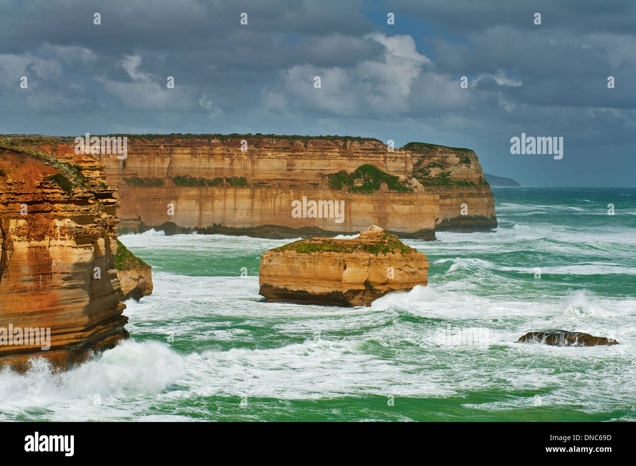 Towering cliffs braving the elements in Port Campbell National Park. Stock Photo