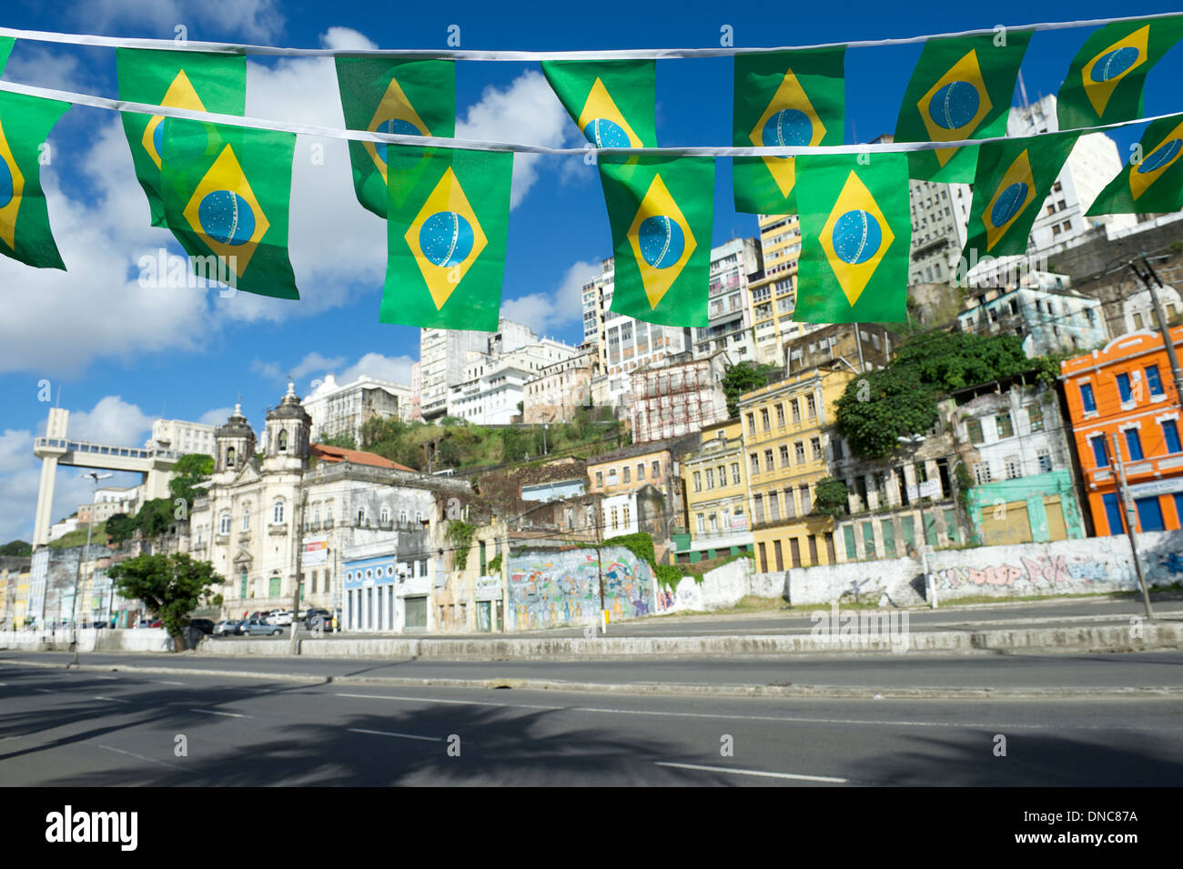 Brazilian flags flying over sunny view of Cidade Baixa Lower City in