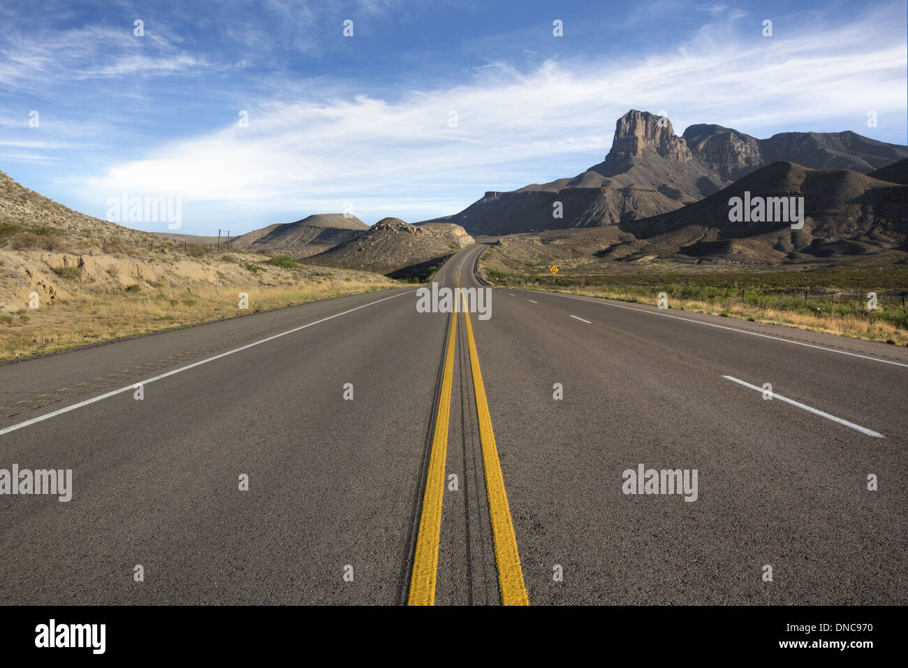 A lonely highway leads to Guadalupe Mountains National Park in far west Texas. Stock Photo