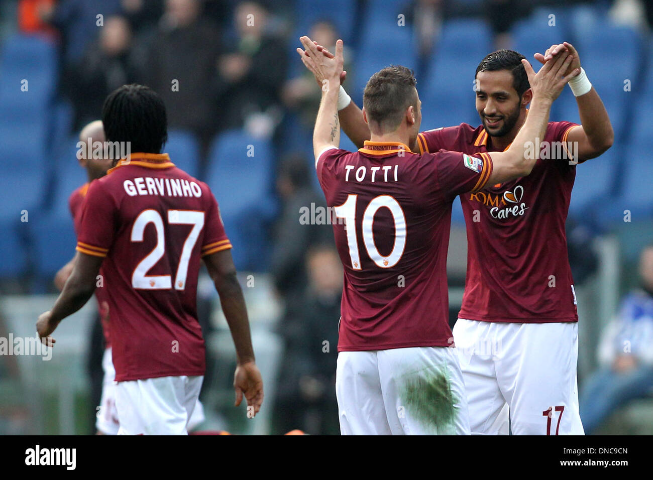 Rome, Italy. 22nd Dec, 2013. Serie A Football. Roma versus Catania. Benatia (roma) celebrates his goal with the team during the Italian Serie A league game between Roma-Catania in olyimpic stadium in Rome. Credit:  Action Plus Sports/Alamy Live News Stock Photo