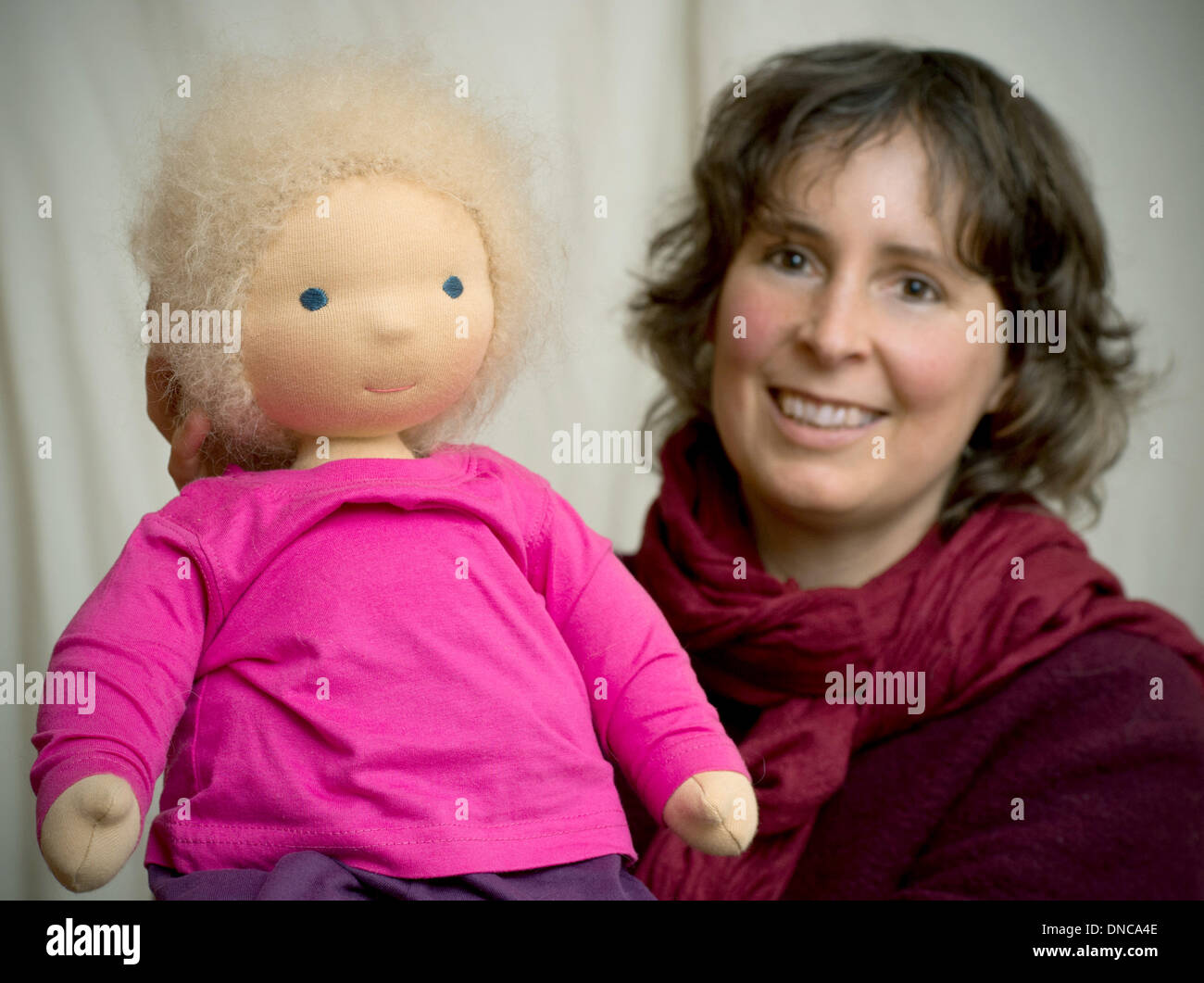 The doll maker Julia Dobrusskin-Schautt shows one of her dolls in  Niebendorf, Germany, 14 March 2013. The dolls are made of natural materials  like cotton fabric and wool and have names like