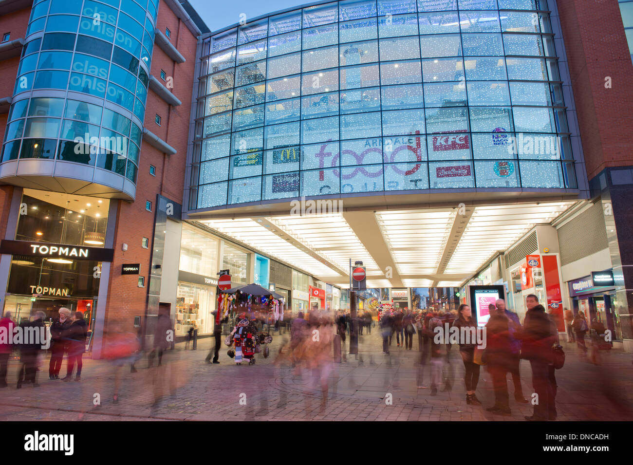 Manchester, UK. 22nd December, 2013. An external shot of Manchester Arndale shopping centre and Market Street during the Christmas lead up period. Market Street is one of the busiest commercial thoroughfares in the city. Credit:  Russell Hart/Alamy Live News Stock Photo