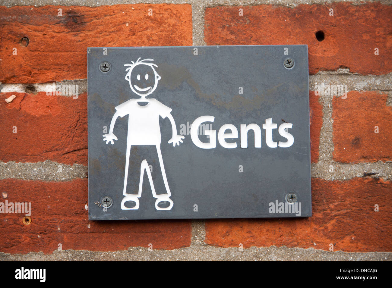 Drawing sign white figure on black slate for Gents toilets, UK Stock