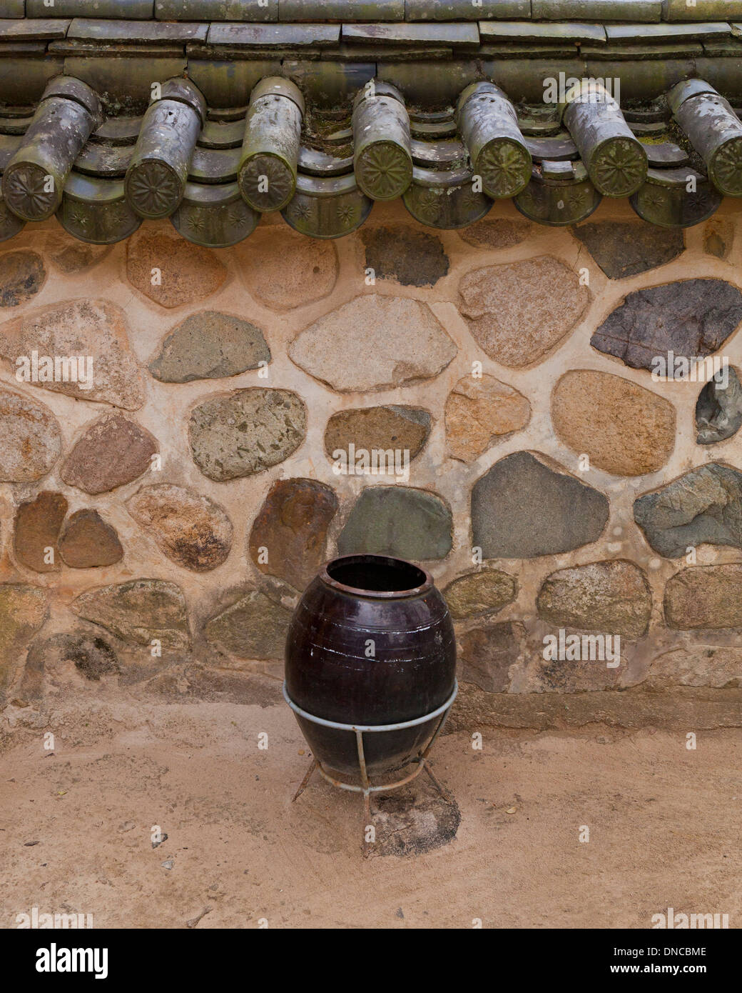 Giwa (fired clay roof tiles) used on  traditional Hanok style stone wall fence - Gyeongju, South Korea Stock Photo