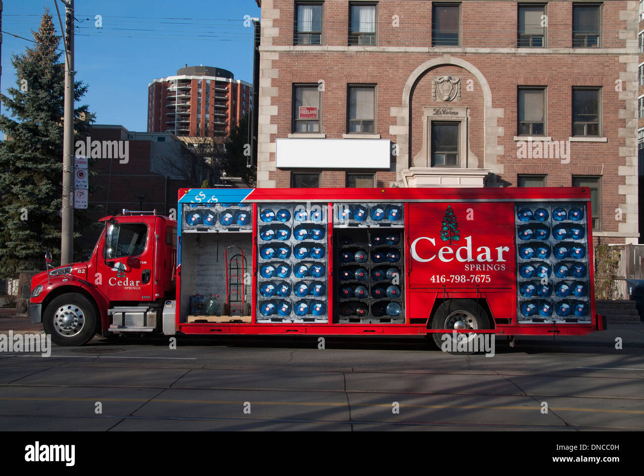 A bottled water delivery truck with painted exterior doors to reflect its contents. Stock Photo