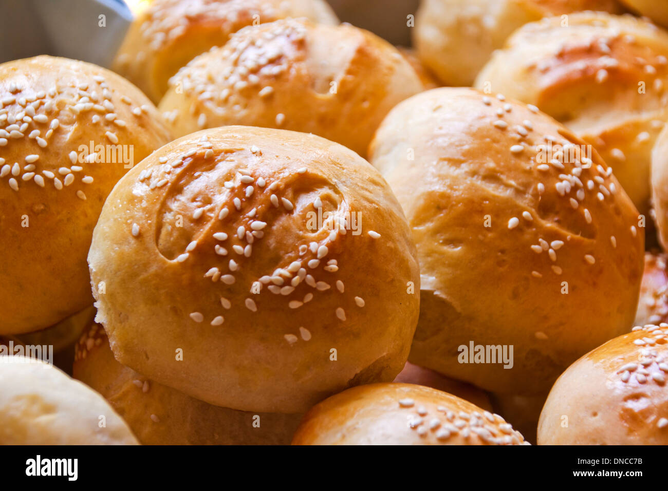 sesame seed covered bread rolls ready for eating Stock Photo Alamy
