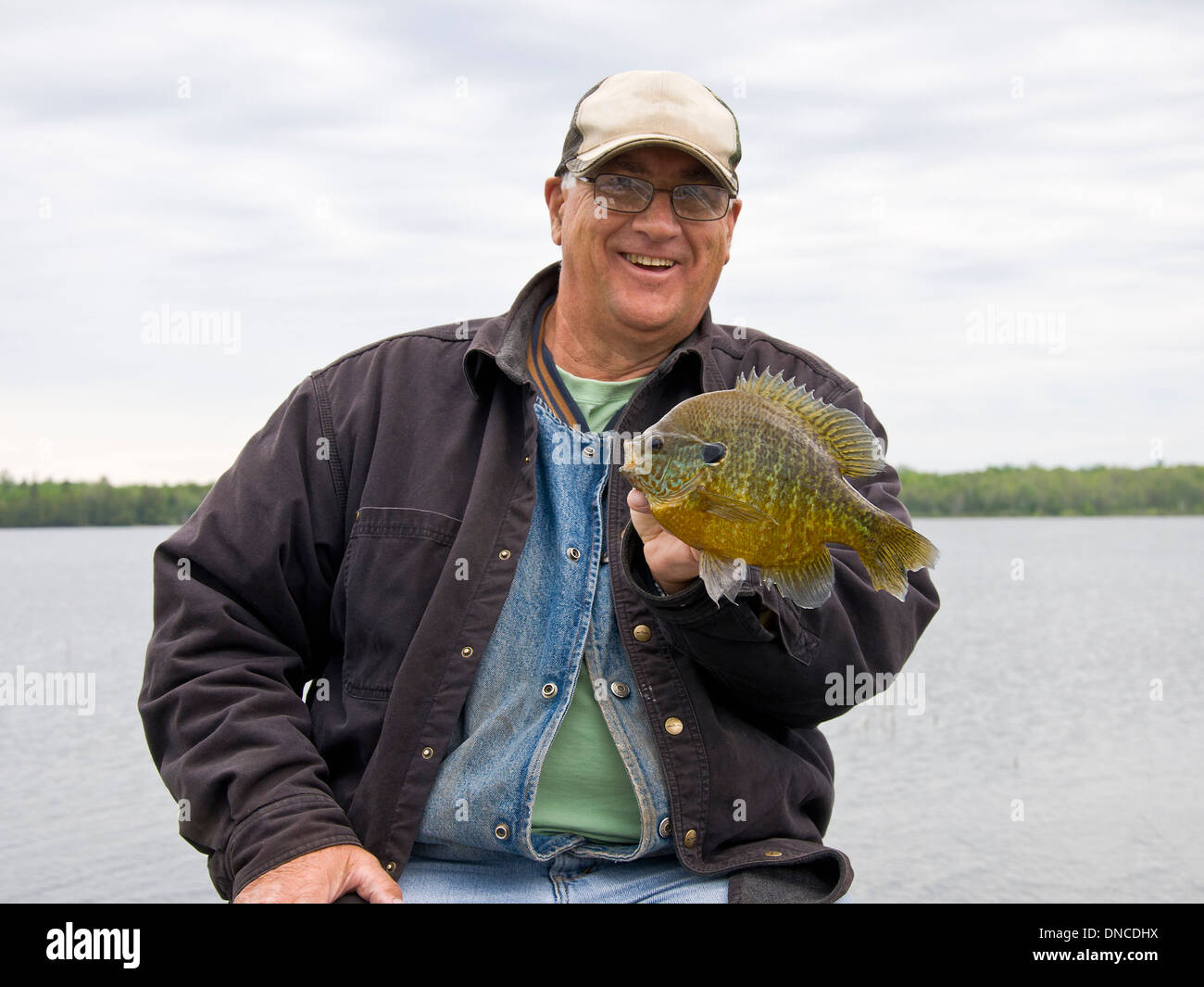 Fisherman with a large Sunfish Stock Photo
