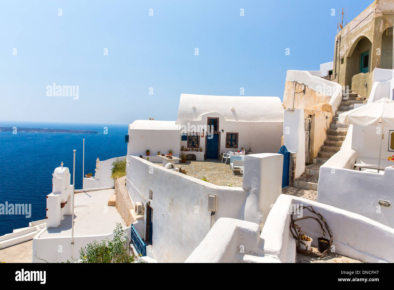 View of Fira town Santorini island Crete Greece. White concrete staircases leading down to