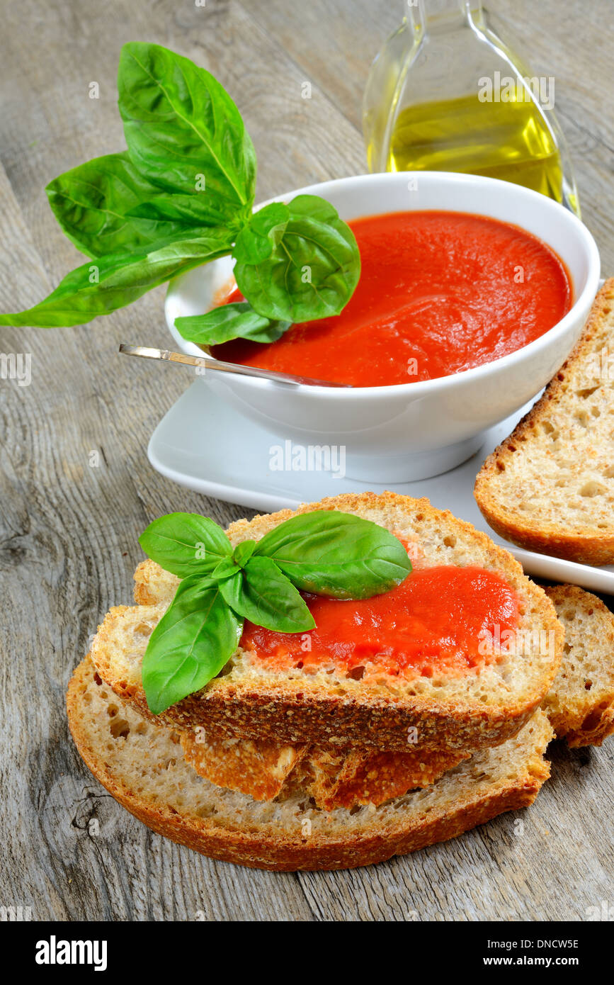 bruschetta with tomatoe sauce fresh basil olive oil Stock Photo - Alamy