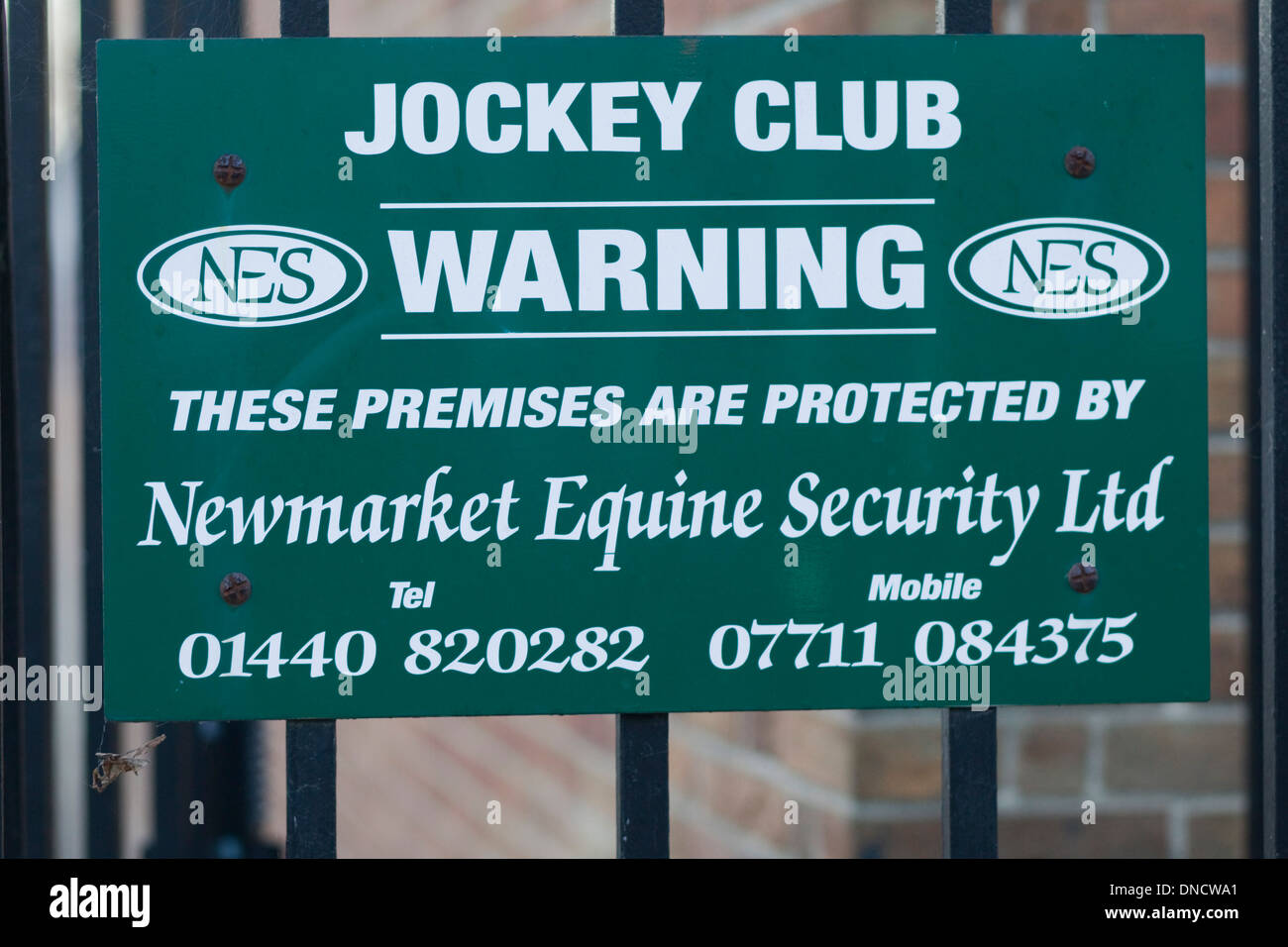 Newmarket Jockey Club Warning Sign Protected by the Newmarket equine Security Ltd Stock Photo