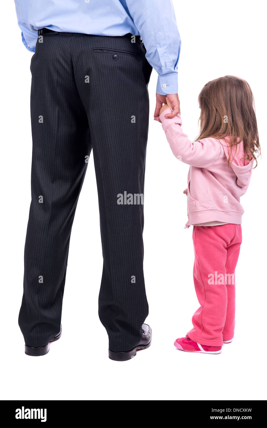 Young girl holding her father's hand Stock Photo
