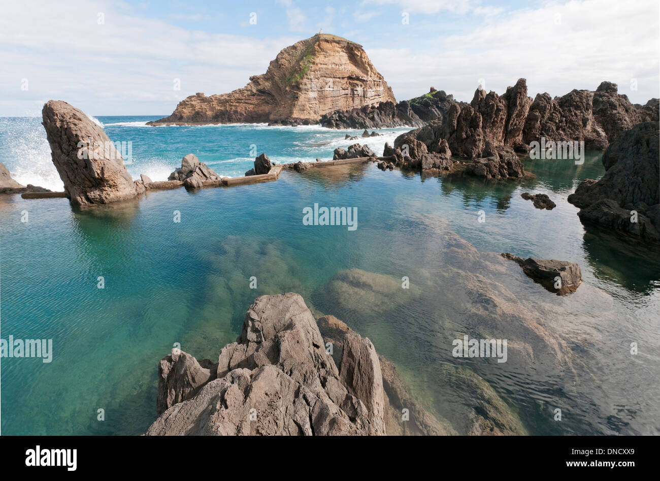 The natural rock swimming pools of Porto Moniz, Madiera, Portugal provide shelter from the Atlantic ocean Stock Photo
