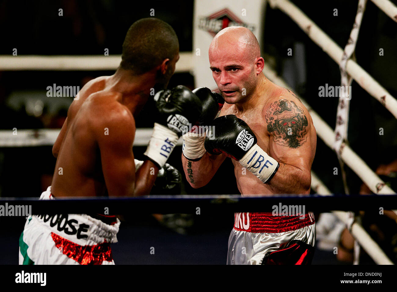 21.12.2013 Elche Spain. Jeffrey Mathebula of Shouth Africa (L) and Kiko Martinez of Spain in action during the Super Bantamweight World championship boxing title fight between Kiko Martínez of Spain and Jeffrey Mathebula of Shouth Africa at the Esperanza Lag Arena, Elche Stock Photo