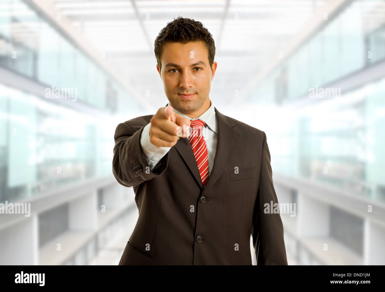 young business man in a suit pointing with his finger Stock Photo - Alamy