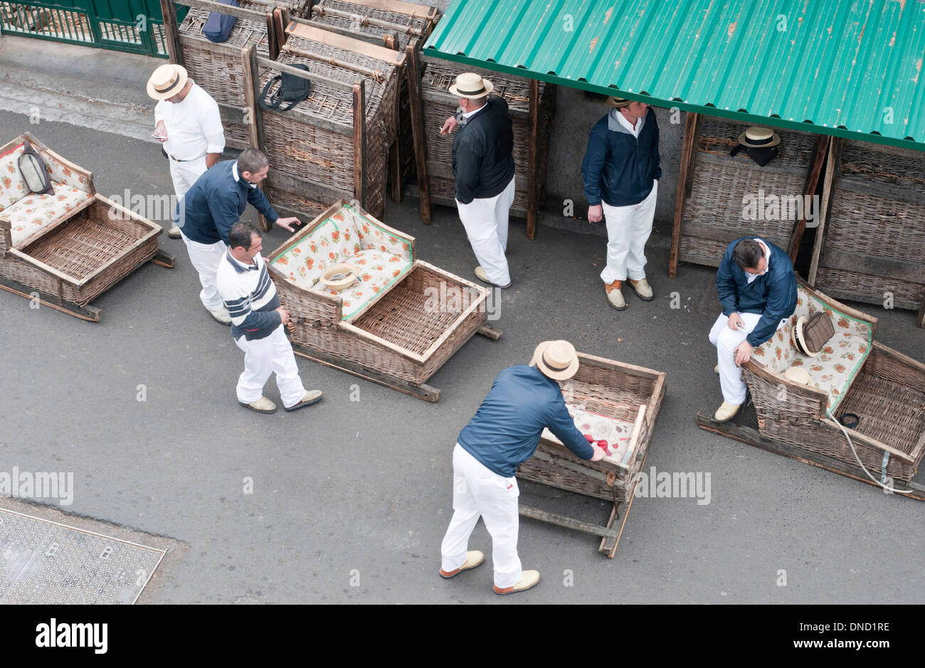 Portugal, Madeira, Monte. 'Carreiros' wait for passengers to ride in their wicker basket toboggans. Stock Photo