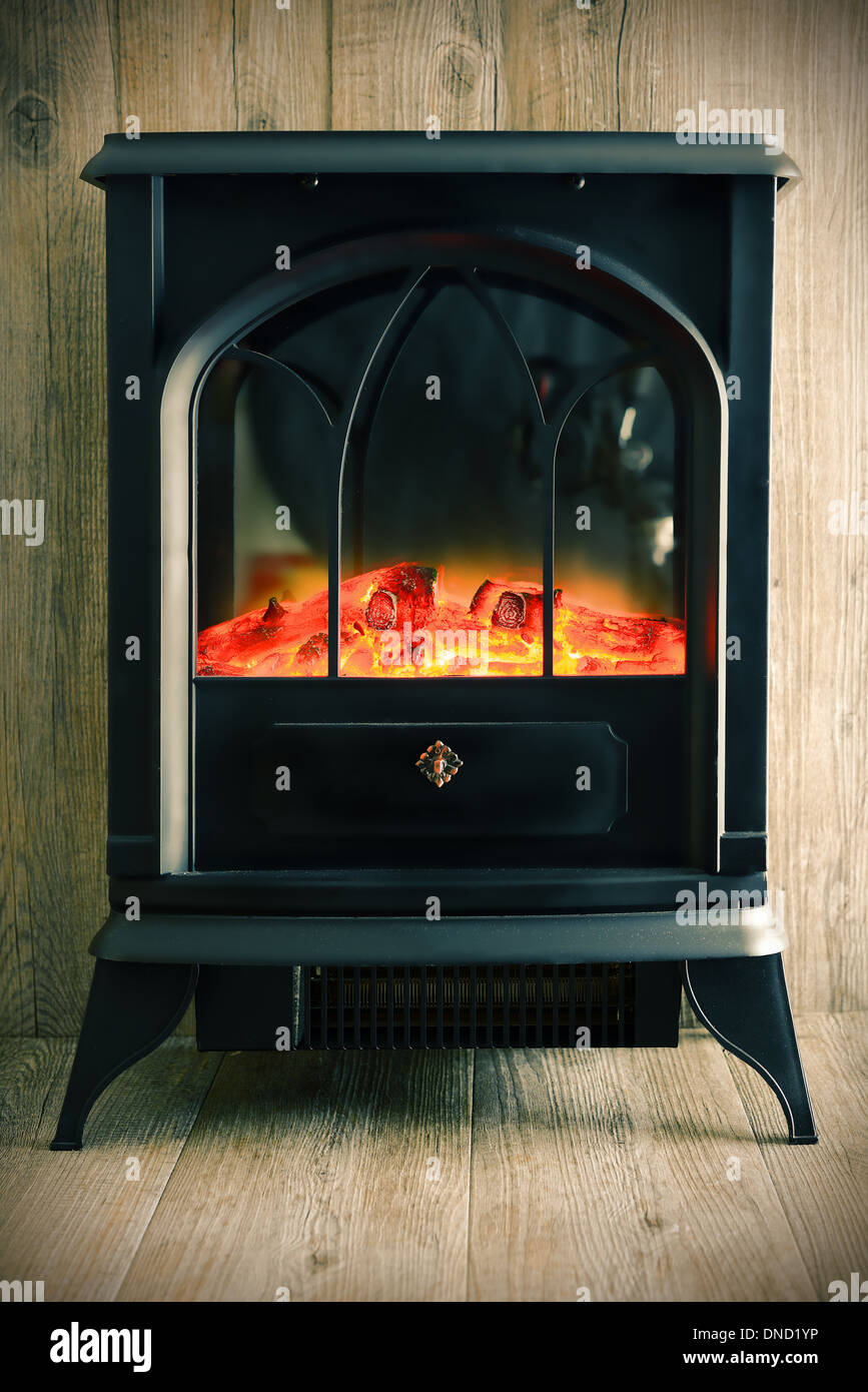 retro model of fireplace on wood background Stock Photo