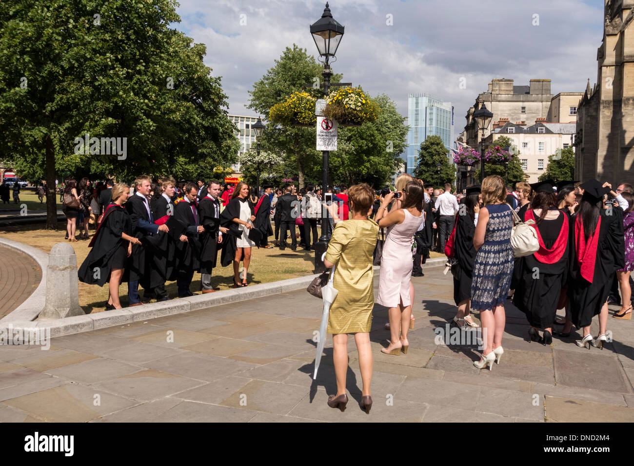 UWE (University of the West of England) students in College Green after graduation ceremony at Bristol Cathedral, UK Stock Photo