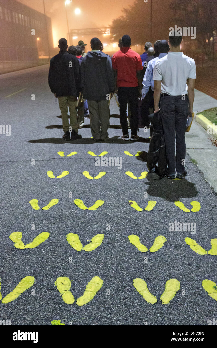 US Marine Corps Drill Instructors direct newly arrived recruits through receiving at Marine Corps Recruit Depot Parris Island to begin 13 weeks of boot camp December 9, 2013 in Port Royal, South Carolina. The Marines train about 17,000 recruits at Parris Island yearly. Stock Photo