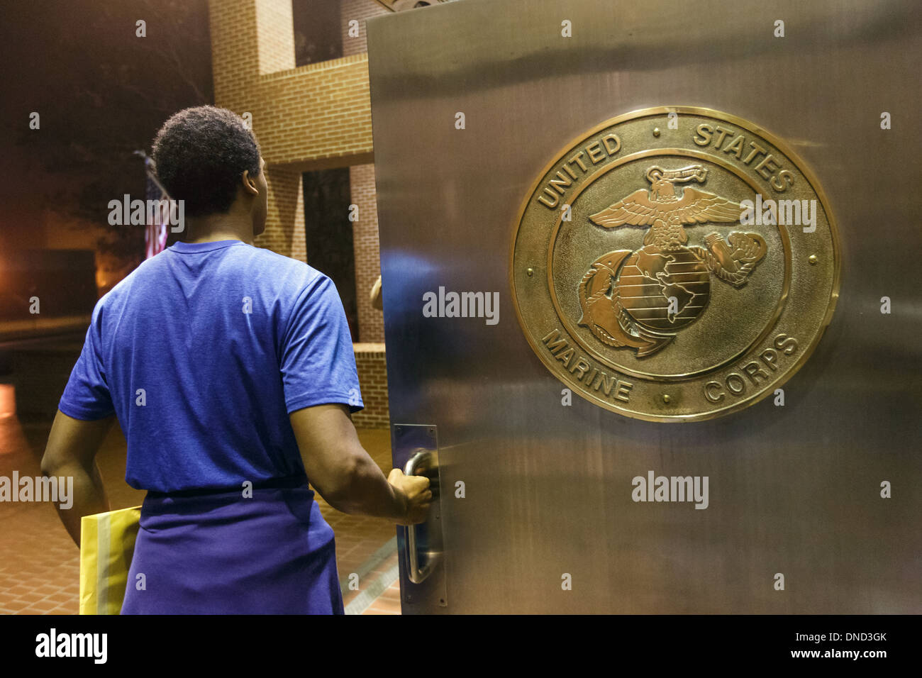US Marine Corps Drill Instructors direct newly arrived recruits through
