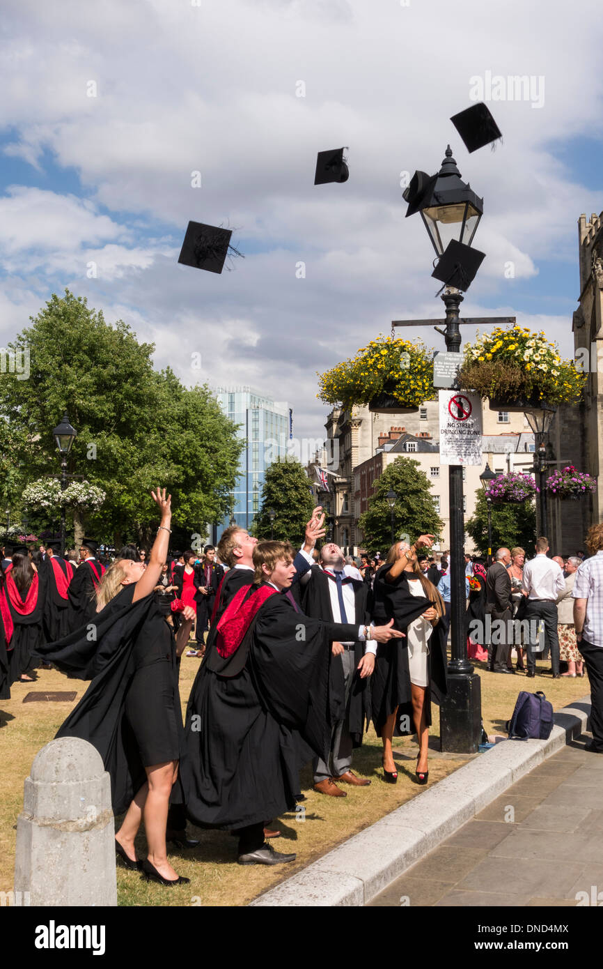 Graduates throwing their mortarboards after the ceremony. UWE