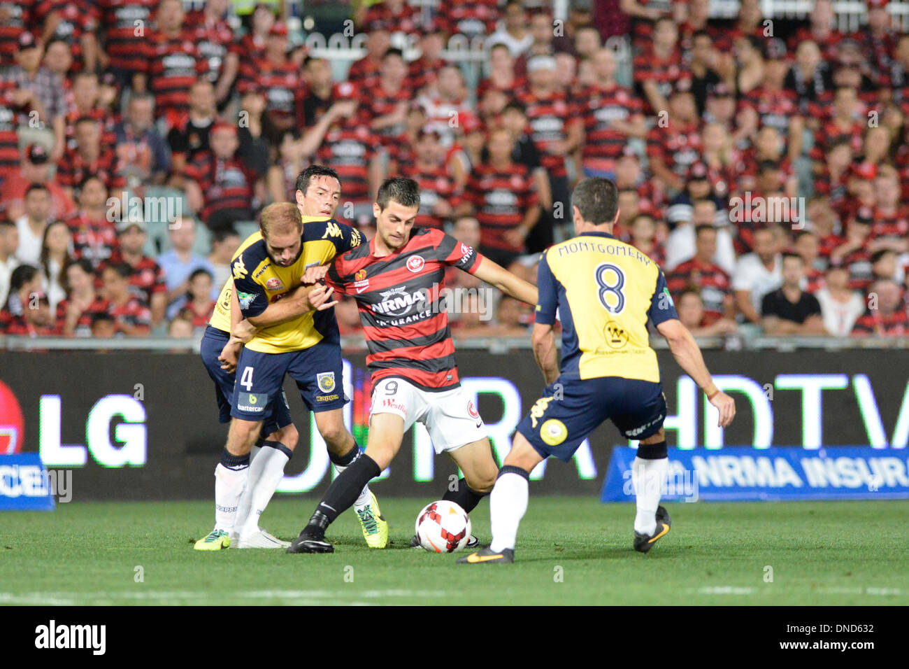 Sydney, Australia. 23rd Dec, 2013. Mariners defender Marcel Seip and Wanderers forward Tomi Juric in action during the Hyundai A League game between Western Sydney Wanderers FC and Central Coast Mariners FC from the Pirtek Stadium, Parramatta. The Wanderers won 2-0. Credit:  Action Plus Sports/Alamy Live News Stock Photo