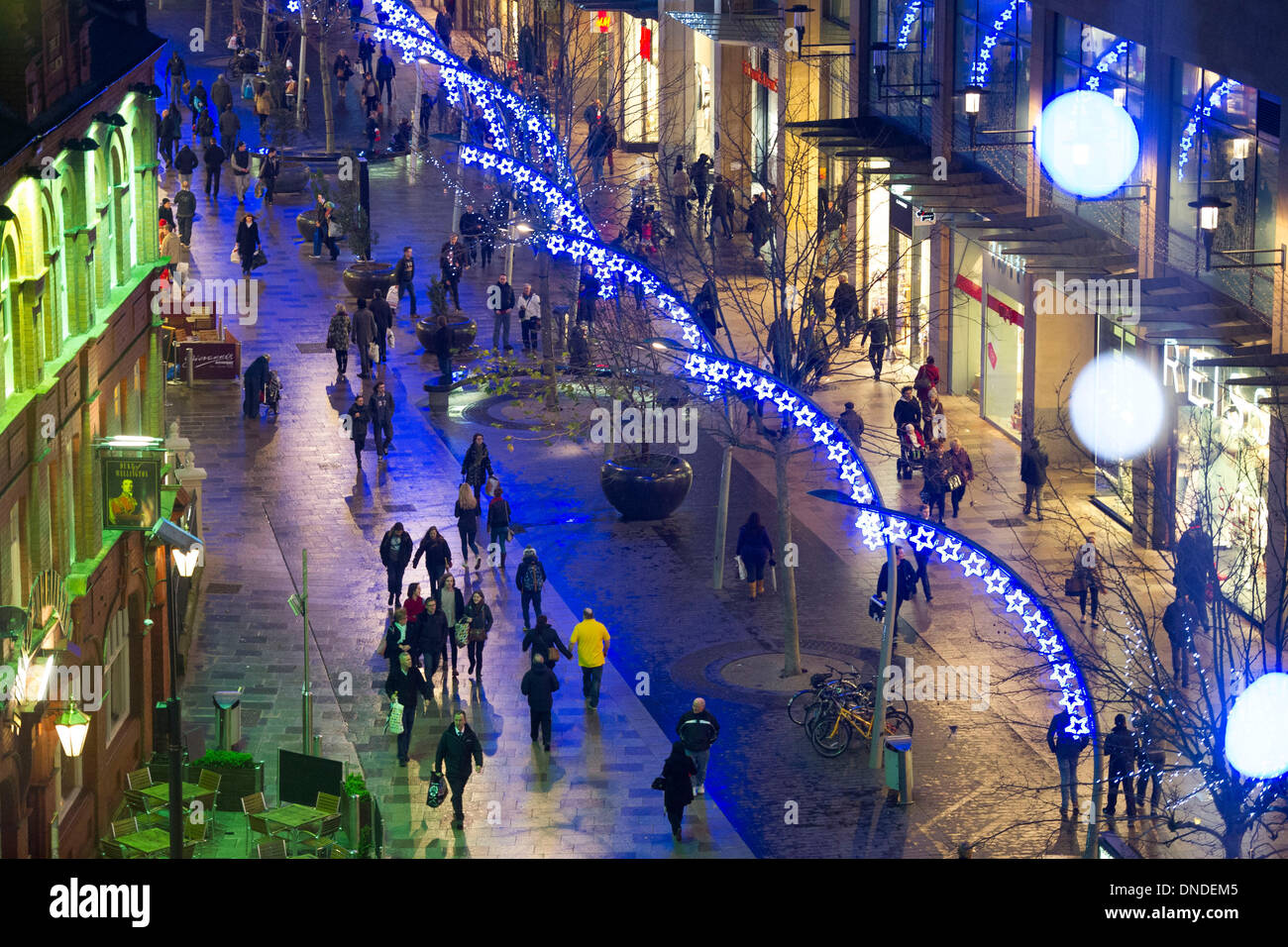 Cardiff, Wales, UK. December 23. Christmas shoppers brave bad weather late on Mega Monday to go shopping for last minute presents on December 23 Cardiff, Wales. Shoppers are expected to spend £12 billion in four days. Some shops have already started their sales. (Photo by Matthew Horwood/Alamy Live News) Stock Photo