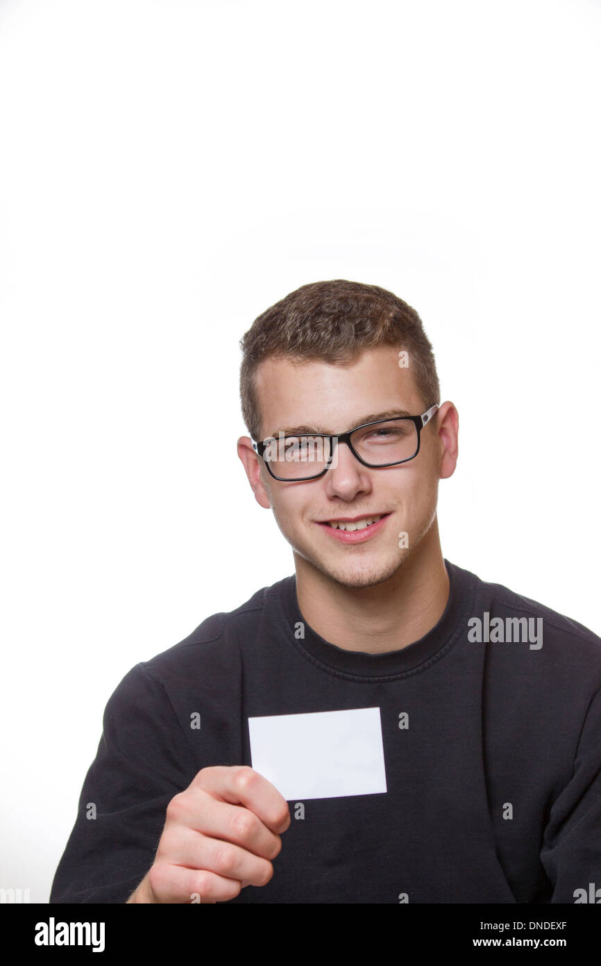 Young welldressed worker or mechanic presenting his business card Stock Photo