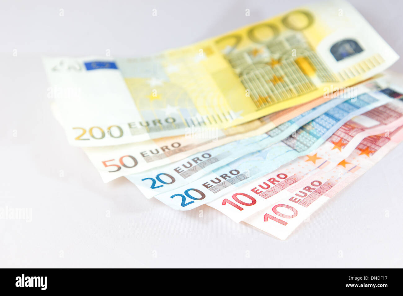 Euro notes lying on other notes with light white background Stock Photo