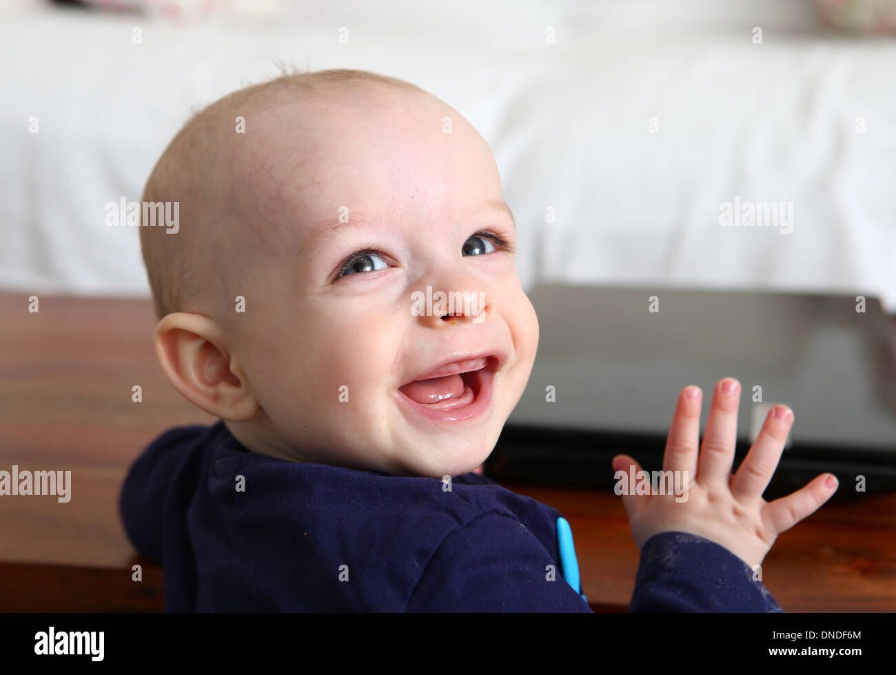 9 months old baby boy laughing Stock Photo