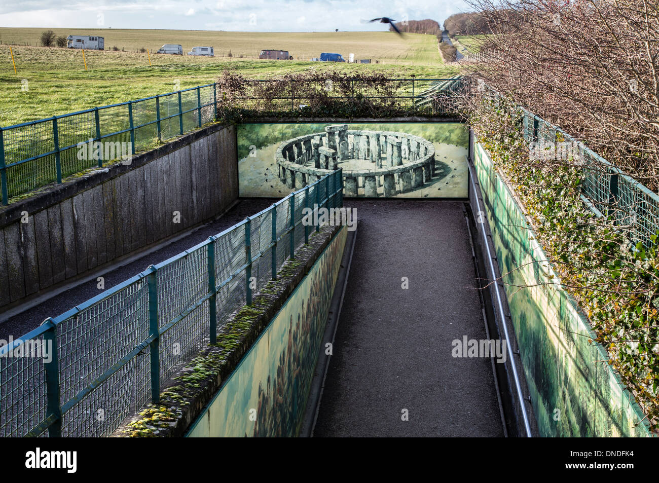 Disused foot tunnel at Stonehenge in Wiltshire UK featuring a fine mural of the henge and soon to be demolished (winter 2013) Stock Photo