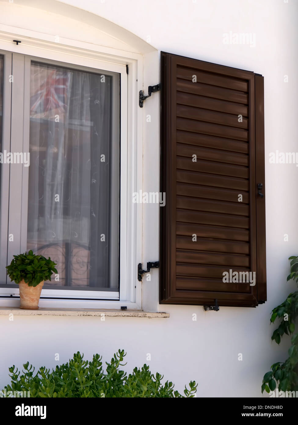 A typical shuttered window in the fishing village of Skala Kefalonia Greece Stock Photo