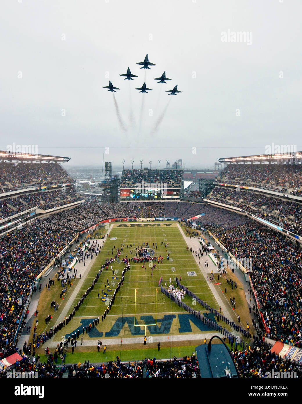 The US Navy Blue Angels flyover Lincoln Financial Field prior to the 114th Army-Navy game kickoff December 14, 2013 in Philadelphia, PA. Stock Photo