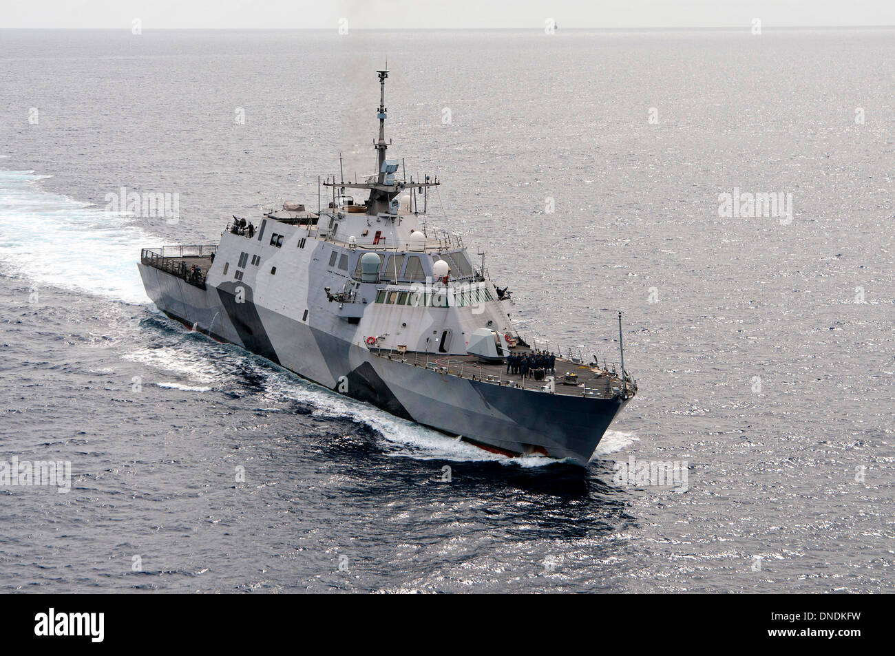 The US Navy's first high tech littoral combat ship, USS Freedom prepares to enter the channel of Joint Base Pearl Harbor-Hickam after the maiden proof-of-concept deployment December 13, 2013 in Honolulu, HI. Stock Photo