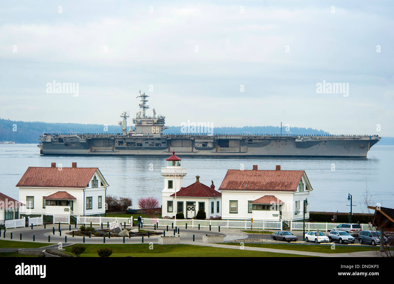 US Navy aircraft carrier USS Nimitz passes by Mukilteo Lighthouse Park