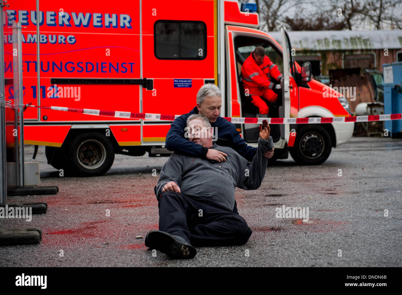 Hamburg, Germany. 18th Dec, 2013. Fire fighters demonstrate rescue ...