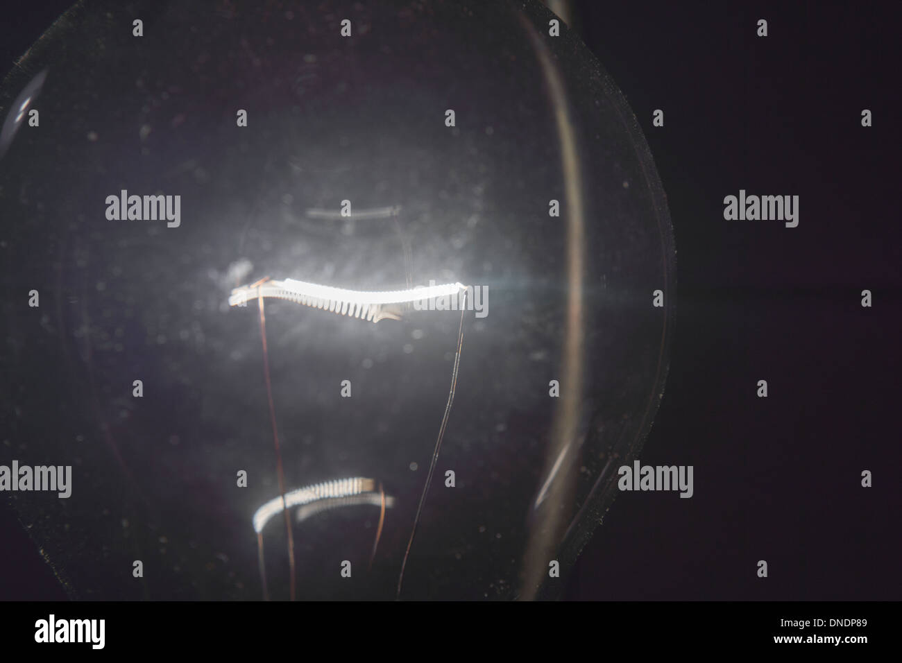 The filament of a 60 watt incandescent bulb is seen in New York Stock