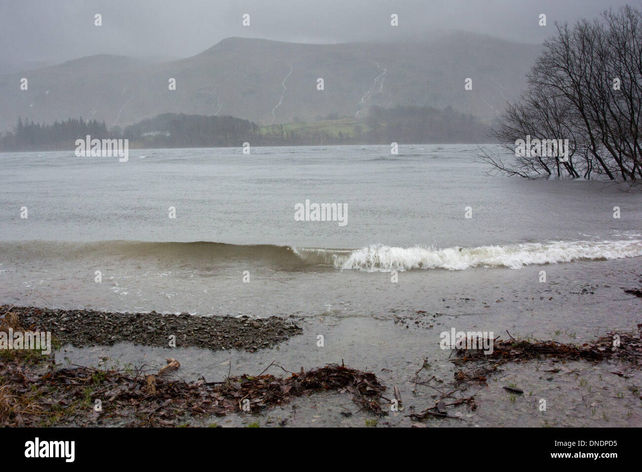 Thirlmere, Lake District, UK. 23rd Dec, 2013. Heavy rain and stormy conditions on Thirlmere, with swollen streams running down the side of Helvelyn, in the Lake District, Cumbria. Credit:  Wayne HUTCHINSON/Alamy Live News Stock Photo