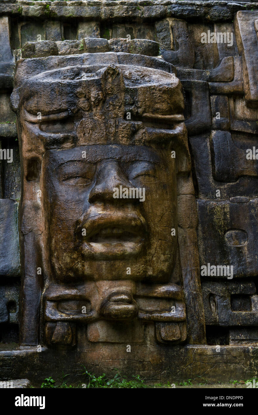 close up of a large rock face on the Mask Temple in Lamanai Belize Stock Photo