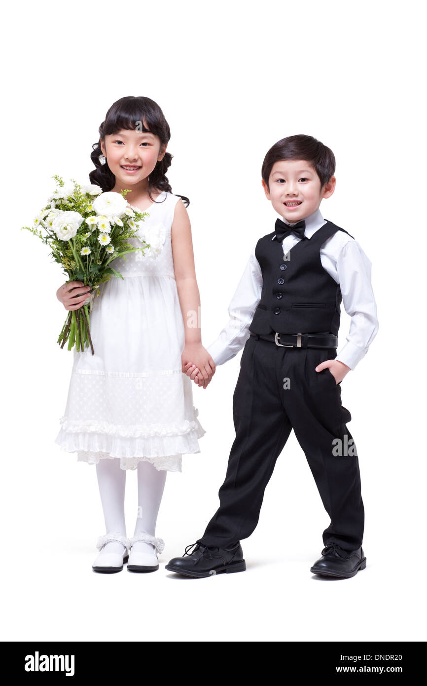 Cute girl and little boy holding hands Stock Photo - Alamy