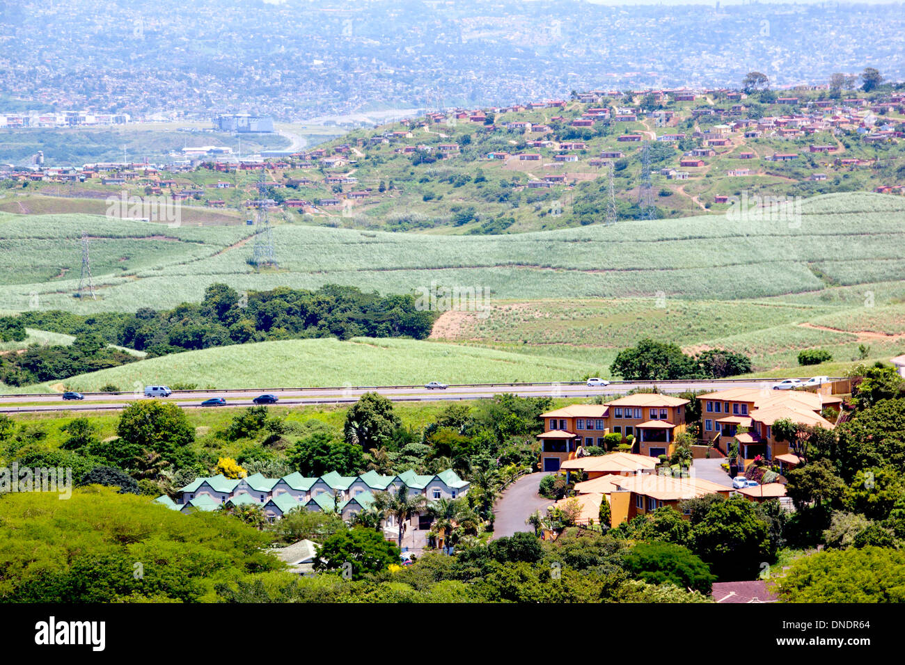 upmarket housing estate with sprawling low cost housing in background