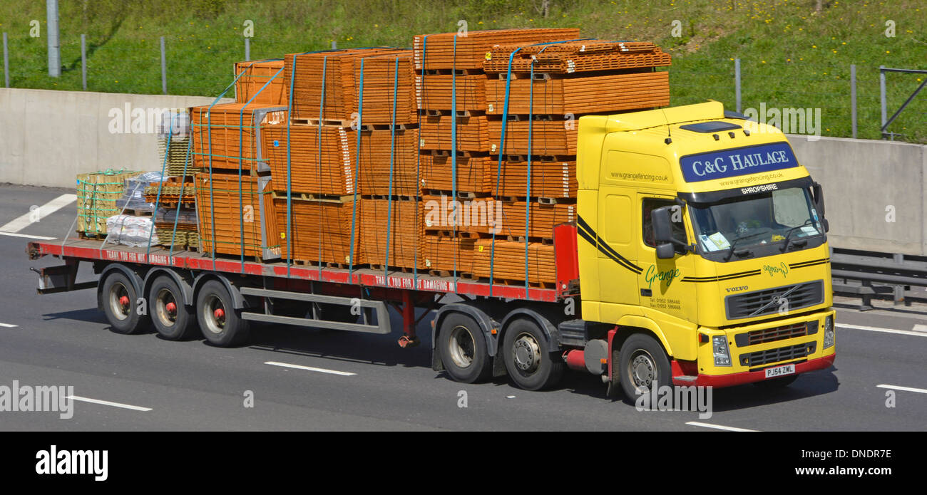 Haulage contractor truck and articulated trailer loaded with timber fencing panels Stock Photo