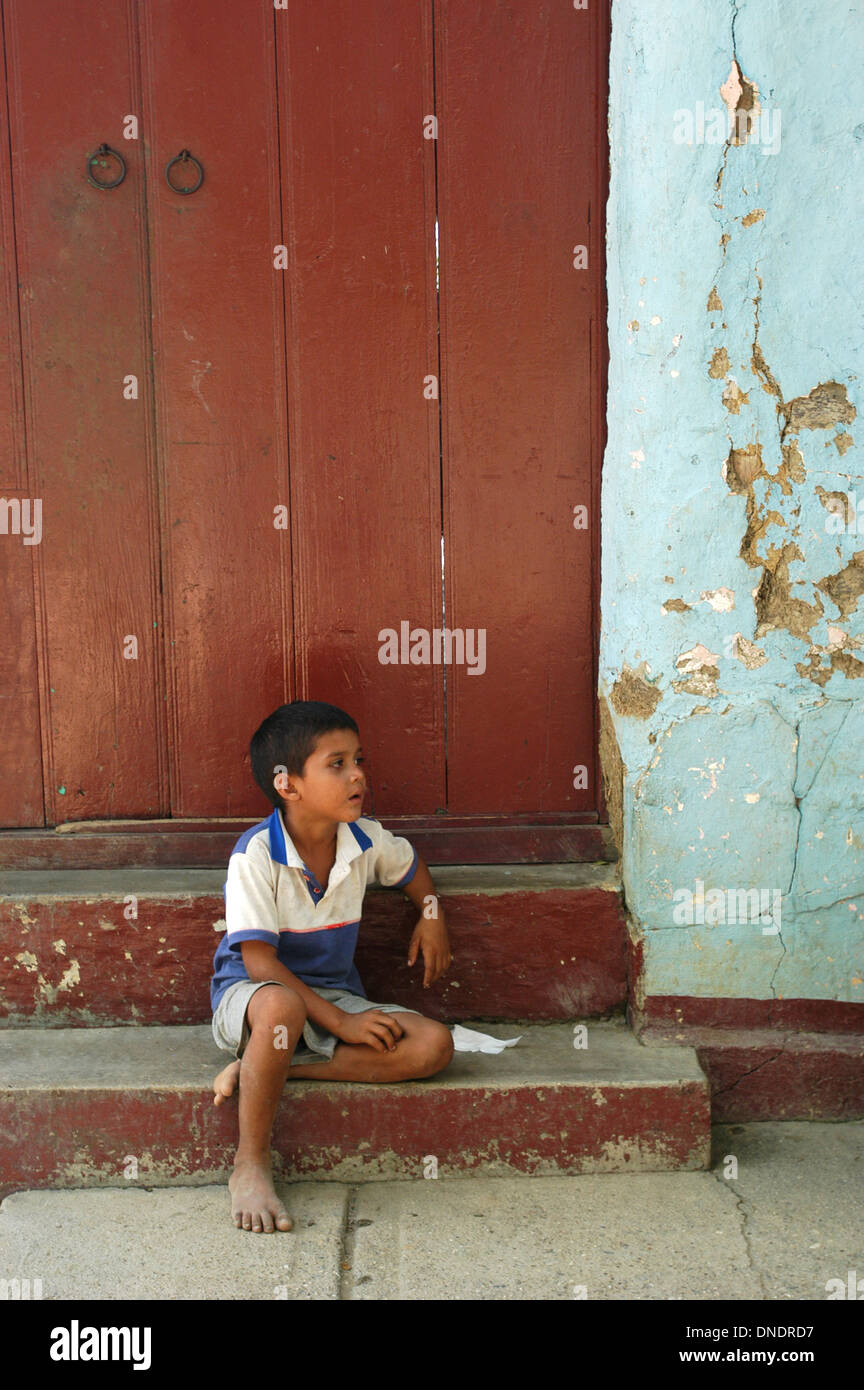 A boy stands in a street in a small village of Barinas State, Venezuela, November 26, 2004. Stock Photo
