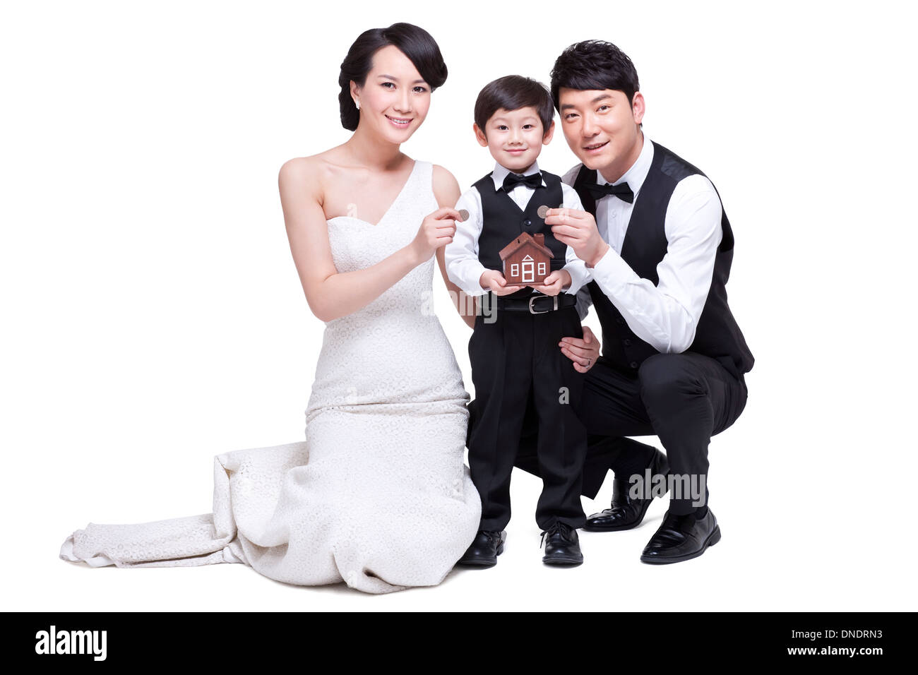 Elegant family with piggy bank Stock Photo